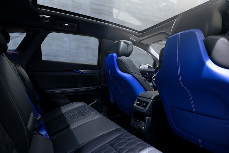 Back Seat View of the 2026 OPTIQ-V Blue Front Seats, Sun Roof, and Interior | Otto Cadillac in Albany NY